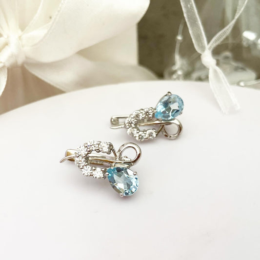 עגילים אלגנטיים מעוטרים בטופז כחול שמיים