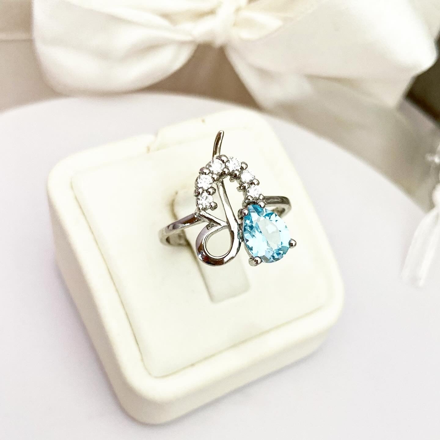 Elegant set of earrings, ring, and pendant with Sky Blue Topaz