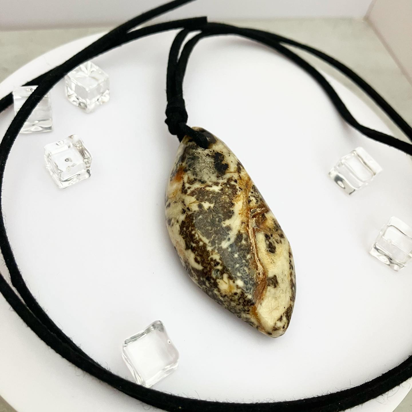 Pendant from amber on a leather cord "Colombia"