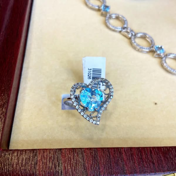 Heart-shaped ring with Sky Blue Topaz