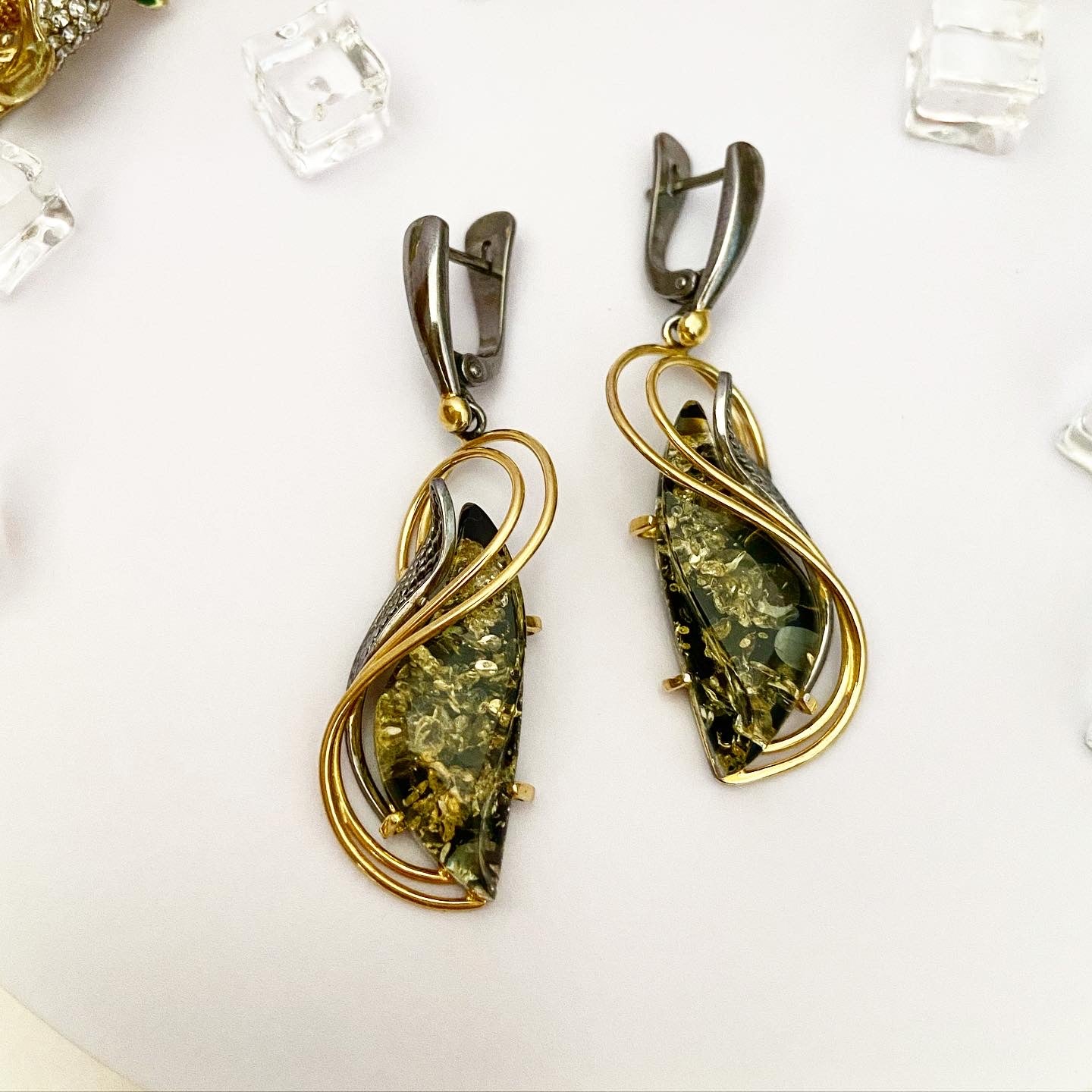 Earrings with green amber