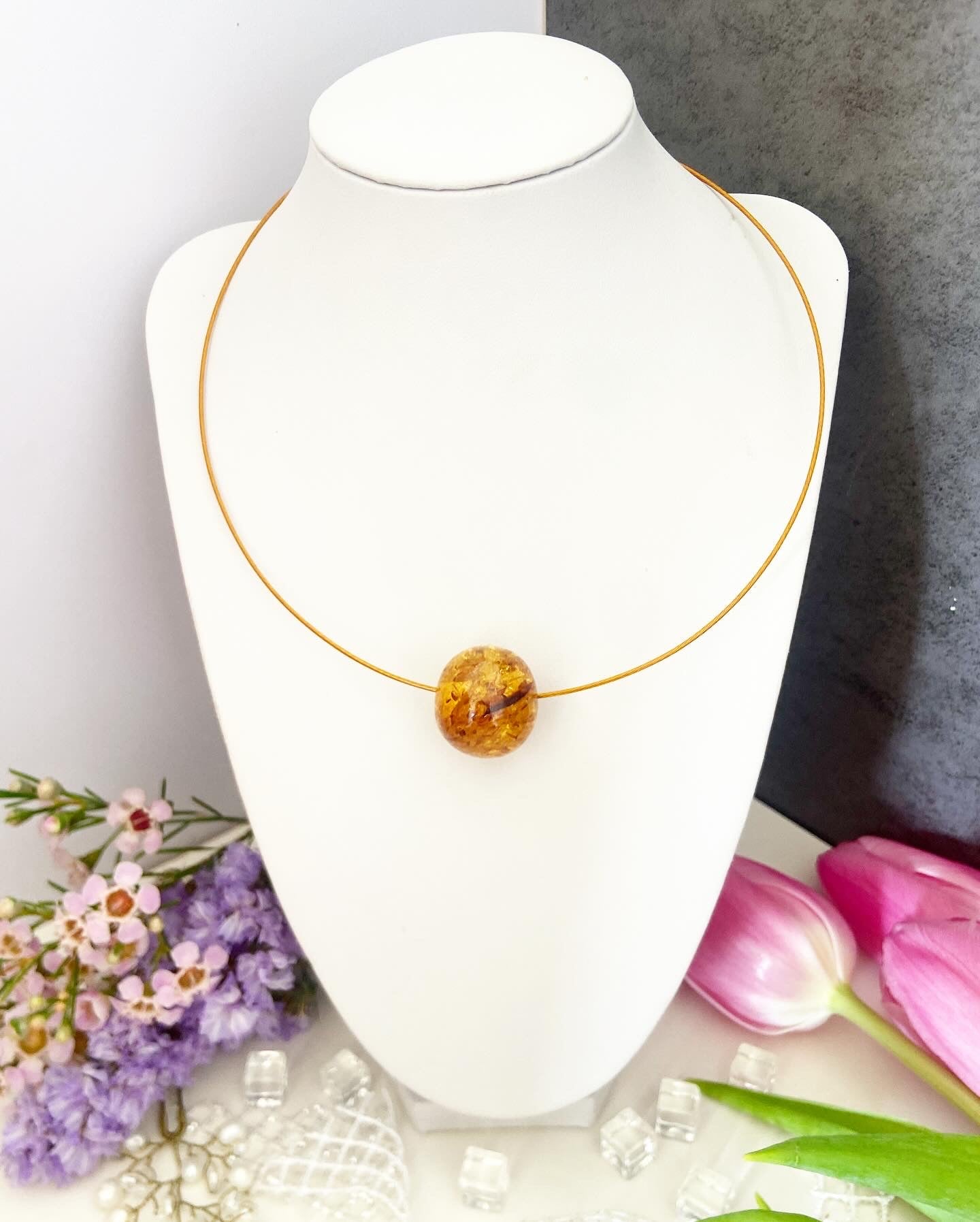 Necklace on a wire with an amber bead