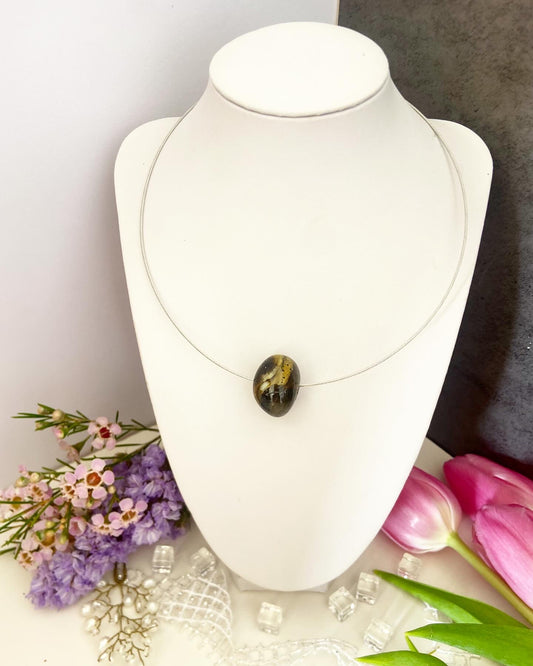 Necklace on a wire with an amber bead