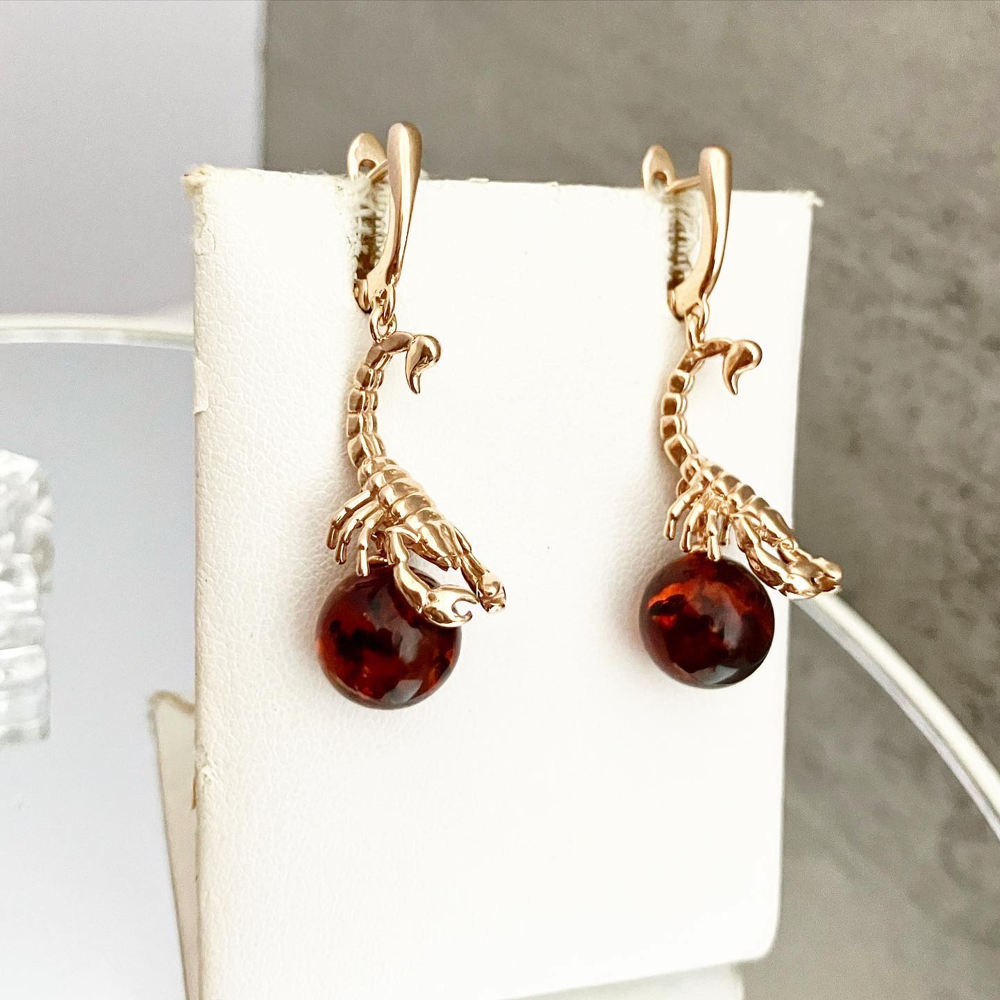 Earrings made of silver with gilding and natural amber.