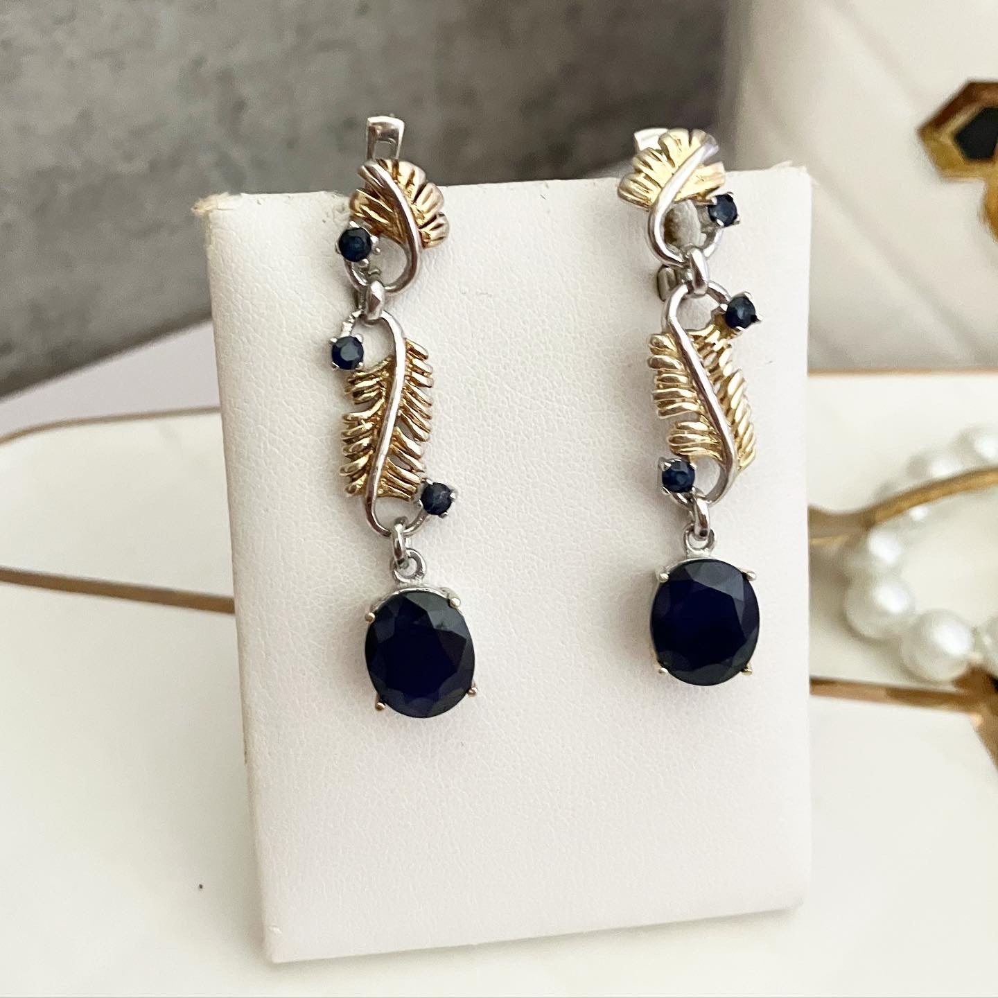 Earrings silver with partial gilding and sapphires.