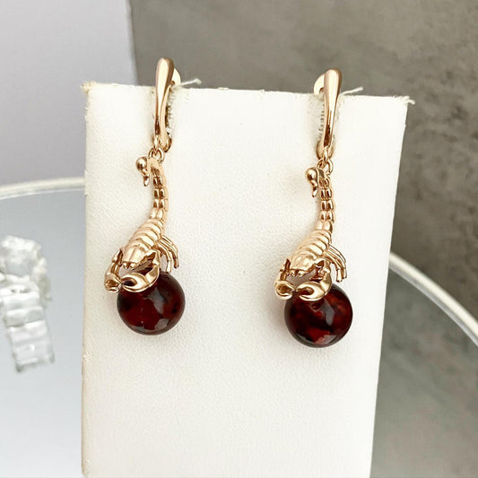 Earrings made of silver with gilding and natural amber.